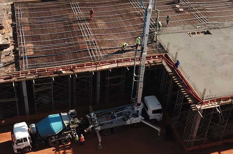 Concrete boom pump placing pump mix concrete at height